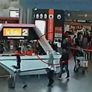 A still image from a CCTV footage appears to show (circled in red) a man purported to be Kim Jong Nam being accosted by a woman in a white shirt at Kuala Lumpur International Airport in Malaysia on February 13, 2017. (FUJITV/Reuters)