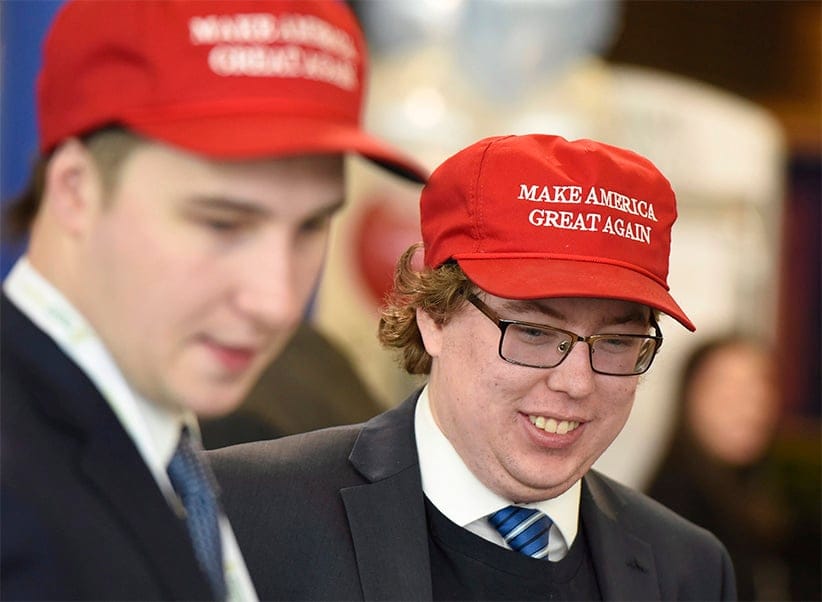Alex Walsh, right, and Matt Atkins wear Make America Great Again hats as they attend the Manning Centre conference on Friday, Feb. 24, 2017 in Ottawa. (Justin Tang/CP)