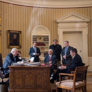 President Donald Trump speaks on the phone with Russian President Vladimir Putin in the Oval Office of the White House, January 28, 2017 in Washington, DC. Also pictured, from left, White House Chief of Staff Reince Priebus, Vice President Mike Pence, White House Chief Strategist Steve Bannon, Press Secretary Sean Spicer and National Security Advisor Michael Flynn. (Drew Angerer/Getty Images)