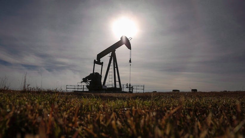A pumpjack works at a well head on an oil and gas installation near Cremona, Alta., Saturday, Oct. 29, 2016.The Canadian economy exits 2016 with bruises from the still-tough adjustment to weak crude prices and scars from the devastating wildfires that singed the oil patch. THE CANADIAN PRESS/Jeff McIntosh