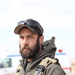 Alex Moreau, the 36- year old Vancouver native and the co-founder of MERMT outside the clinic south of Mosul that will serve as a frontline emergency medical response centre for civilians injured during phase 3 of the fight against ISIS.  Moreau began as a foreign fighter in Syria but realized that emergency medical services were more important than killing ISIS fighters. (Photograph by Adnan Khan)