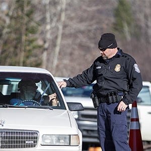 A U.S. Customs and Border Protection agent hands a passport back to a driver entering from Canada at the United States Border Inspection Station in Norton, Vermont, U.S., on Friday, Nov. 18, 2016.  (Scott Eisen/Bloomberg via Getty Images)