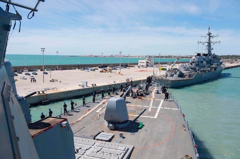 In this photo provided by the U.S. Navy, the Arleigh Burke-class guided-missile destroyer USS Ross (DDG 71) departs Rota, Spain, on March 29, 2017. The United States fired a barrage of cruise missiles into Syria Thursday night in retaliation for a gruesome chemical weapons attack against civilians, the first direct American assault on the Syrian government and Donald Trump's most dramatic military order since becoming president. (Mass Communication Specialist 3rd Class Robert S. Price/U.S. Navy via AP)