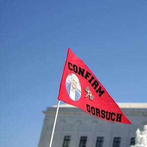 WASHINGTON, DC - MARCH 29:  Members of Public Advocate of the U.S. hold up signs to support the Gorsuch nomination during a news conference in front of the Supreme Court March 29, 2017 in Washington, DC. Senator Chuck Grassley (R-IA) held a news conference to discuss Senate Democrats' attempt to filibuster Judge Neil Gorsuch's Supreme Court nomination.  (Alex Wong/Getty Images)