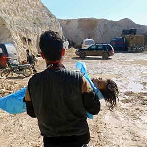 A man carries the body of a dead child, after what rescue workers described as a suspected gas attack in the town of Khan Sheikhoun in rebel-held Idlib, Syria April 4, 2017. (Ammar Abdullah/Reuters)