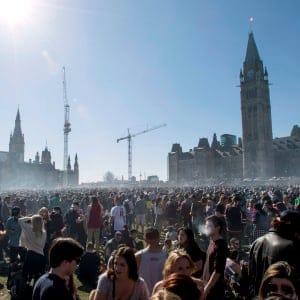 A cloud of smoke rises above the lawns of Parliament Hill during the annual 420 marijuana rally, Wednesday, April 20, 2016 in Ottawa. (Justin Tang/CP)
