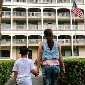 Ana and her son Eddy (last names withheld) walk near Loyola New Orleans College of Law in New Orleans on March 27, 2017. (Photograph by William Widmer/Redux)