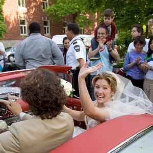 New bride Sophie Gregoire waves to the crowds with her husband Justin Trudeau, son of the late Prime Minister Pierre Elliot Trudeau, as they drive off in his father's refurbished 1959 Mercedes 300SL, following their wedding ceremony in Montreal May 28, 2005. (Christinne Muschi/Reuters)