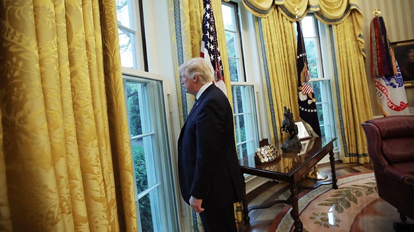 U.S. President Donald Trump looks out a window of the Oval Office following an interview with Reuters at the White House in Washington, U.S., April 27, 2017. (Carlos Barria/Reuters)