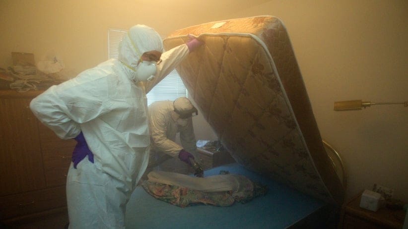 Christian Cadieux (R), owner of Bed Bugs Bite , and employee Jeff Lake fumigates a matress as part of their process to get rid of bedbugs.  (Andrew Francis Wallace/Toronto Star/Getty Images)
