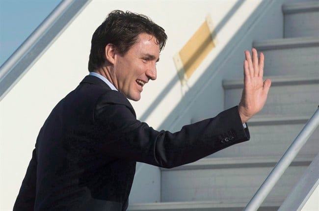 Canadian Prime Minister Justin Trudeau waves as he boards his plane in Strasbourg, France, on Thursday, February 16, 2017. Trudeau heads to Europe this week for the NATO and G7 summits, where global leaders are trying to figure out exactly how the world works now that U.S. President Donald Trump is at the table. THE CANADIAN PRESS/Adrian Wyld