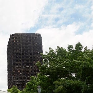 The charred remains of clading are pictured on the outer walls of the burnt out shell of the Grenfell Tower block in north Kensington, west London on June 22, 2017.
Combustible cladding has been found in "a number" of publicly-owned tower blocks in Britain following emergency checks ordered after the June 14 devastating fire at Grenfell Tower, British Prime Minister Theresa May said Thursday. "A number of these tests have come back as combustible," May said in a statement to parliament after ordering checks on all similar blocks.   (NIKLAS HALLE'N/AFP/Getty Images)