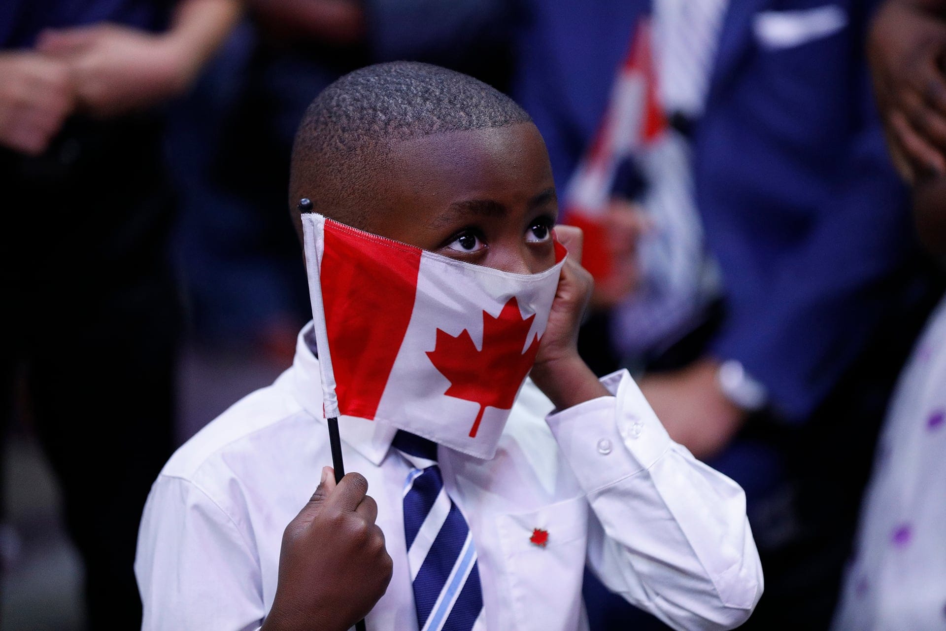 Citizenship ceremony, presided over by Ken Dryden, at the Canadian Tire Centre in Ottawa June 26, 2017. 150 new Canadians were celebrated. Photograph by Blair Gable