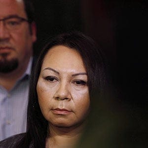 Sheila North Wilson, right, grand chief of Manitoba Keewatinowi Okimakanak, speaks to media as Derek Nepinak, grand chief of the Assembly of Manitoba Chiefs, listens in after RCMP announced at a press conference in Winnipeg, Friday, March 18, 2016. Wilson is asking Prime Minister Justin Trudeau to help a remote First Nation left in crisis after a fire destroyed the community's only grocery store and band office. (John Woods/CP)