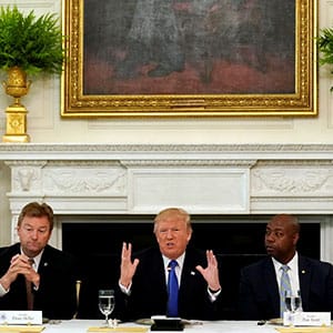 U.S. President Donald Trump speaks during a lunch meeting with Senate Republicans to discuss healthcare at the White House in Washington, U.S., July 19, 2017. From left are U.S. Senators Shelley Moore Capito (R-WV), Dean Heller (R-NV), Tim Scott (R-SC) and Lisa Murkowski (R-AK). (Kevin Lamarque/Reuters)