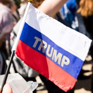 "Trump" emblazoned on a Russian flag is held by a demonstrator outside the White House in Washington during protests against the firing of FBI Director James Comey, Wednesday, May 10, 2017. (Doug Mills/The New York Times/Redux)