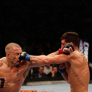 Nick Diaz punches Georges St-Pierre in their welterweight championship bout during the UFC 158 event at Bell Centre on March 16, 2013 in Montreal, Quebec, Canada.  (Josh Hedges/Zuffa LLC/Zuffa LLC/Getty Images)