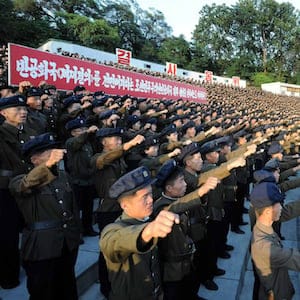 This picture taken on August 11, 2017 and released by North Korea's official Korean Central News Agency (KCNA) on August 12, 2017 shows North Korean youths and workers and trade union members holding a rally to protest the UN Security Council's "sanctions resolution" at the Youth Park Open-Air theatre in Pyongyang. (STR/AFP/Getty Images)