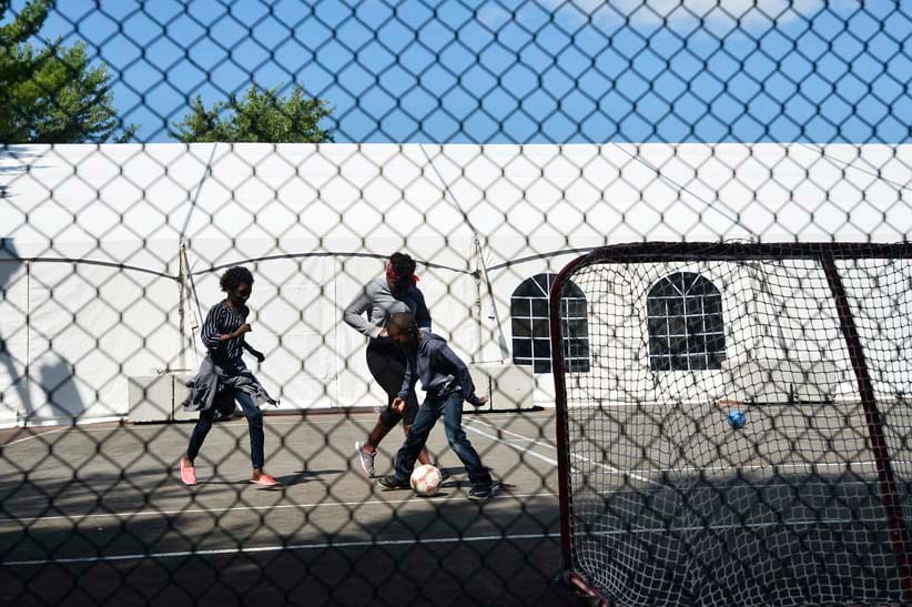 Haitian asylum seekers coming from the United States play soccer at the NAV Centre in Cornwall, Ont., on Sunday, August 27, 2017. (Photograph by Matthew Usherwood)