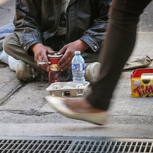 TORONTO  ON - Michael Manitowabie 42, panhandles on his corner at Richmond and Simcoe as he has done (according to him) for 20 years   June 18, 2013.