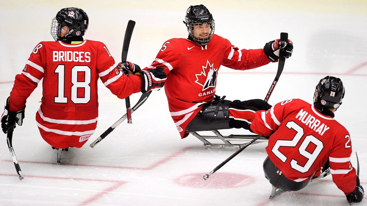 Rempel, centre, with Team Canada in 2012. (Larry MacDougal/CP)