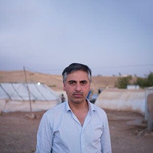 Payam Akhavan, law professor at McGill University  at  Yazidi  refugee camp Khanke outside of Duhok, Iraq, July 26, 2016. (Photograph by Peter Bregg, C.M.)