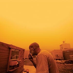 U.S. Army Cpt. Patrick Heim from Bonn, Germany with 2nd Battalion, 508th Parachute Infantry Regiment shaves during a sand storm in his base in Arghandab valley, near Kandahar, in southern Afghanistan, May 5, 2010. U.S. forces are massing on the outskirts of Kandahar for the biggest military offensive of the nearly nine-year-old war, in the hope of turning the tide against a strengthening Taliban insurgency. REUTERS/Yannis Behrakis (AFGHANISTAN - Tags: MILITARY CONFLICT IMAGES OF THE DAY)