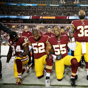 LANDOVER, MD - SEPTEMBER 24: Washington Redskins players during the the national anthem before the game against the Oakland Raiders at FedExField on September 24, 2017 in Landover, Maryland. (Photo by Patrick Smith/Getty Images)