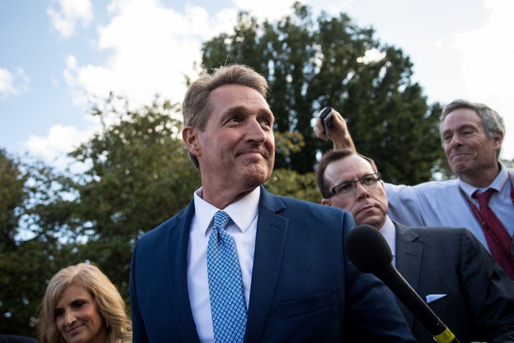 WASHINGTON, DC - OCTOBER 24:  Sen. Jeff Flake (R-AZ) and his wife Cheryl Flake leave the U.S. Capitol as they are trailed by reporters, October 24, 2017 in Washington, DC. Flake announced that he will not be seeking re-election and he will leave the Senate after his term ends in 14 months. (Photo by Drew Angerer/Getty Images)