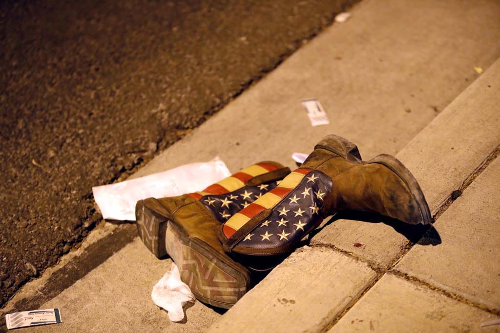 A pair of cowboy boots is shown in the street outside the concert venue after a mass shooting at a music festival on the Las Vegas Strip in Las Vegas, Nevada, U.S. October 1, 2017. (Steve Marcus/Las Vegas Sun/Reuters)