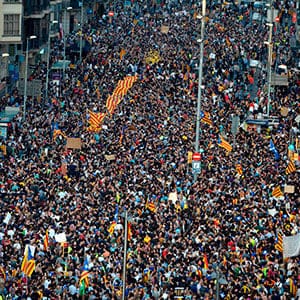 Protesters demonstrate at the Placa de la Universitat square in Barcelona during a general strike in Catalonia called by Catalan unions on October 3, 2017.
Large numbers of Catalans observe a general strike today to condemn police violence at a banned weekend referendum on independence, as Madrid comes under growing international pressure to resolve its worst political crisis in decades. (Josep Lago/AFP/Getty Images)