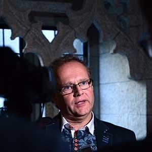 New Brunswick MP Wayne Long speaks to reporters as he leaves a Liberal caucus meeting on Parliament Hill, in Ottawa on Monday, October 16, 2017. THE CANADIAN PRESS/Sean Kilpatrick