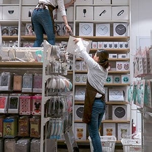 Sales staff in a Miniso shop.  Miniso is a Japanese lifestyle and fast fashion brand that sells merchandise such as homeware, bags and electronics at low prices.  Despite claiming to be a Japanese brand, Miniso had only four stores in Tokyo compared with more than a thousand in China, therefore is widely questioned by the users  for the brands origin and copyright. (Zhang Peng/LightRocket/Getty Images)