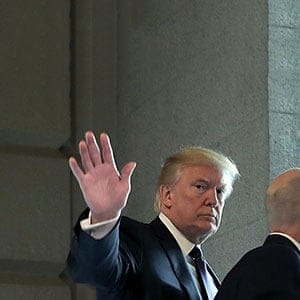 U.S. President Donald Trump (C) waves to journalists as he arrives at the U.S. Capitol for a meeting with the House Republican conference November 16, 2017 in Washington, DC. Trump is huddling with House GOP members on the day they hope to pass tax reform legislation, moving the president one step closer to a promised tax cut for corporations and some individual Americans before the end of the year.  (Chip Somodevilla/Getty Images)