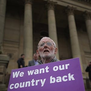 A Vote to Leave campaigner holds a placard as Leader of the United Kingdom Independence Party (UKIP), Nigel Farage campaigns for votes to leave the European Union in the referendum on May 25, 2016 in Bolton, England. Nigel Farage took his battle bus to Bolton encouraging British people to vote to leave the EU on 23rd June 2016.  (Christopher Furlong/Getty Images)