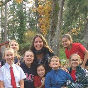Teacher Meaghan Thompson (backrow second from right) with her Grade 6 "classroom family" at St. Margaret's School in Victoria.