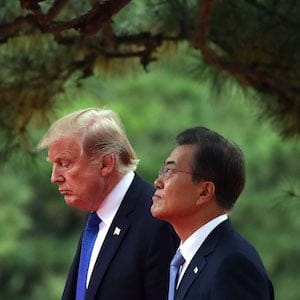 SEOUL, SOUTH KOREA - NOVEMBER 07:  South Korean President Moon Jae-In (R) and U.S. President Donald Trump (L) walk during a welcoming ceremony held at the presidential Blue House on November 7, 2017 in Seoul, South Korea. Trump is in South Korea as a part of his Asian tour.  (Photo by Chung Sung-Jun/Getty Images)