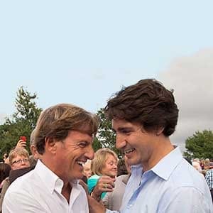 Liberal leader Justin Trudeau, right, chats with Stephen Bronfman, the party's chief fundraiser, at a barn party in St. Peters Bay, P.E.I. on Wednesday, Aug. 28, 2013. The Liberals are holding their summer caucus retreat in nearby Georgetown. THE CANADIAN PRESS/Andrew Vaughan