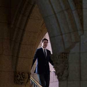 Prime Minister Justin Trudeau speaks with the media in the foyer of the House of Commons following the release of an ethics report in Ottawa on Wednesday December 20, 2017. THE CANADIAN PRESS/Adrian Wyld