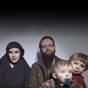 In this file image from video released by Taliban Media in December 2016, Caitlan Coleman talks in the video while her Canadian husband Joshua Boyle holds their two children. The couple and their three children were rescued Wednesday, Oct. 12, 2017, five years after the couple was abducted in Afghanistan on a backpacking trip. The children were born in captivity. (Taliban Media /AP/CP)