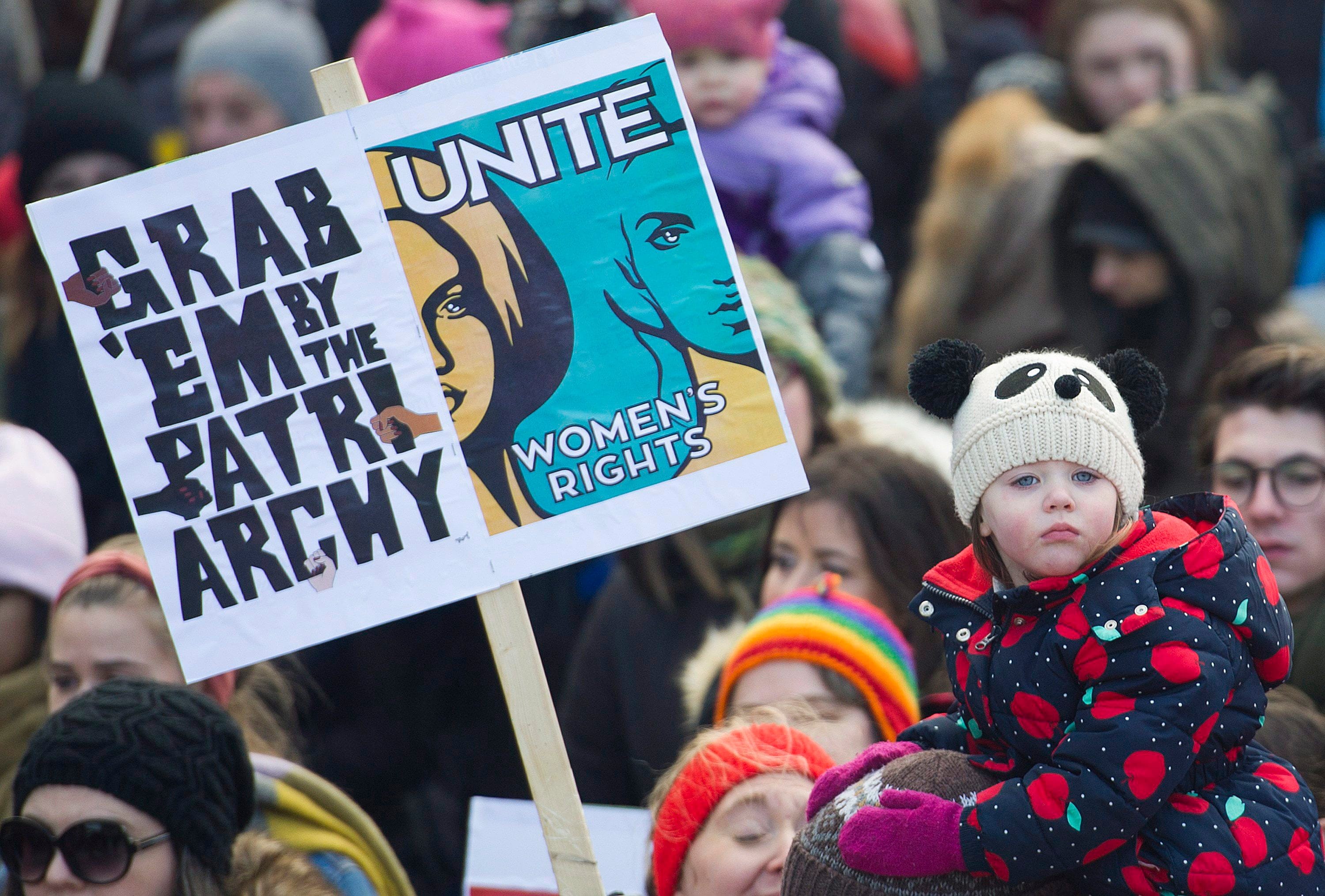 A young girl attends a women's march in Montreal, Saturday, January 20, 2018. (Graham Hughes/CP)