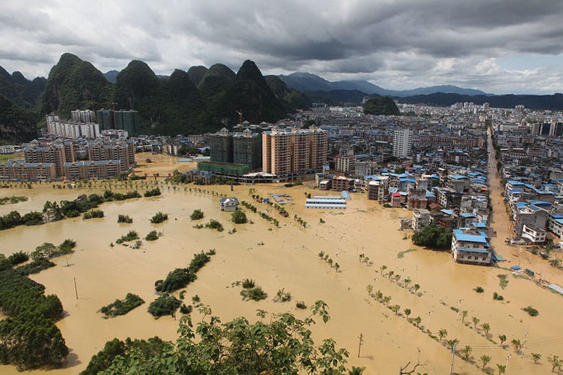 Rising water level causes flood at Rongshui Miao Autonomous County on July 2, 2017 in Liuzhou, Guangxi Zhuang Autonomous Region of China. Continues rain raised the water level of Rong River 5.4 meters higher than the warning line, and left Rongshui county flooded on July 2. (VCG/Getty Images)