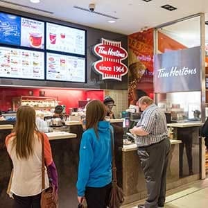 TORONTO, ONTARIO, CANADA - 2015/05/13: Tim Hortons customers line up to order delicious tea, coffee and other treats. (Photo by Roberto Machado Noa/LightRocket via Getty Images)