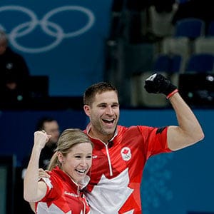 Canada's Kaitlyn Lawes, left, and John Morris celebrate winning the mixed doubles final curling match against Switzerland Jenny Perret and Martin Rios at the 2018 Winter Olympics in Gangneung, South Korea, Tuesday, Feb. 13, 2018. (AP Photo/Natacha Pisarenko)