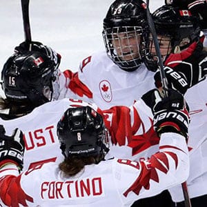 Marie-Philip Poulin (29), of Canada, celebrates with her teammates after scoring a goal against the team from Russia during the second period of the semifinal round of the women's hockey game at the 2018 Winter Olympics in Gangneung, South Korea, Monday, Feb. 19, 2018. THE CANADIAN PRESS/AP-Julio Cortez