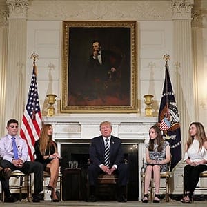 WASHINGTON, DC - FEBRUARY 21:  (AFP OUT) U.S. President Donald Trump (C) holds a listening session with students survivors of mass shootings, their parents and teachers in the State Dining Room at the White House February 21, 2018 in Washington, DC. Trump is hosting the session in the wake of last week's mass shooting at Marjory Stoneman Douglas High School in Parkland, Florida, that left 17 students and teachers dead.  (Photo by Chip Somodevilla/Getty Images)