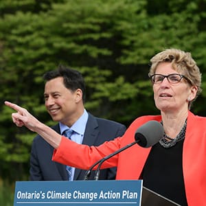 TORONTO, ON - JUNE 8  - Premier Kathleen Wynne speaks to media after announcing Ontario's Five Year Climate Action Plan with Minister of Economic Development, Employment and Infrastructure, Brad Duguid (L) and Environment Minister and Climate Change Glen Murray, at Evergreen Brick Works, Toronto, ON  June 8, 2016.        (Andrew Francis Wallace/Toronto Star via Getty Images)
