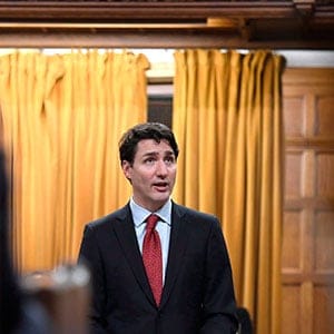 Prime Minister Justin Trudeau looks towards the gallery, where the family of Colten Boushie watch as he delivers a speech on the recognition and implementation of Indigenous rights in in the House of Commons on Parliament Hill in Ottawa on Wednesday, Feb. 14, 2018. THE CANADIAN PRESS/Justin Tang