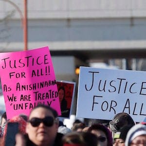 Family and supporters of Thelma Favel, Tina Fontaine's great-aunt and the woman who raised her, march Friday, February 23, 2018, in Winnipeg the day after the jury delivered a not-guilty verdict in the 2nd degree murder trial of Raymond Cormier. THE CANADIAN PRESS/John Woods