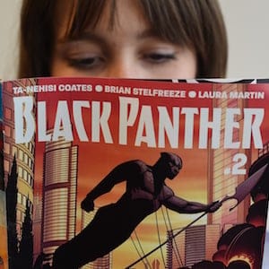 In this photo illustration a woman reads a copy of the Black Panther (T'Challa) a fictional superhero appearing in comic book published by Marvel Comics in New York May 17, 2016.
Captain America and Iron Man may be the stars of Marvel's latest comic-book blockbuster, but Black Panther -- making his big-screen debut -- is most definitely the superhero of the moment. Black Panther, the warrior king of the futuristic fictional African country Wakanda, is starring in a new comic book series that is doing booming sales, and will be the first black hero to get a standalone film, in 2018. The new comic series -- written by acclaimed author Ta-Nehisi Coates, a leading voice on race issues in America -- debuted in April, and so far 330,000 copies of the first issue alone have been sold, according to Marvel.
 / AFP / TIMOTHY A. CLARY / TO GO WITH AFP STORY BY THOMAS URBAIN-"Black Panther, Marvel's African hero, in the spotlight"        (Photo credit should read TIMOTHY A. CLARY/AFP/Getty Images)
